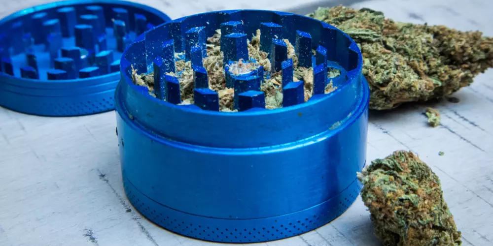 weed grinder with buds around it